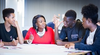 A group pf students working together in a social space